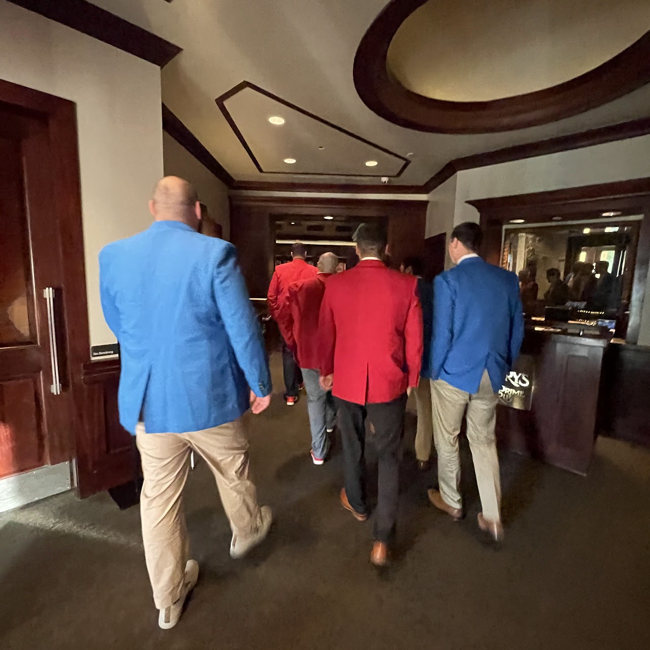 The boys walking into Lawry's in their team blazers