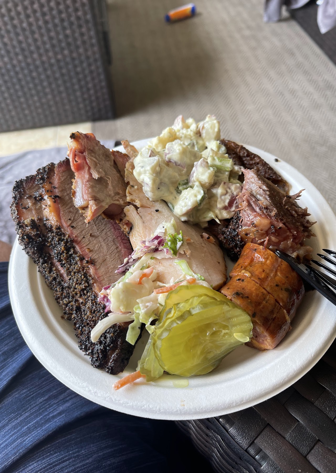 A loaded plate of Terry Black's BBQ poolside