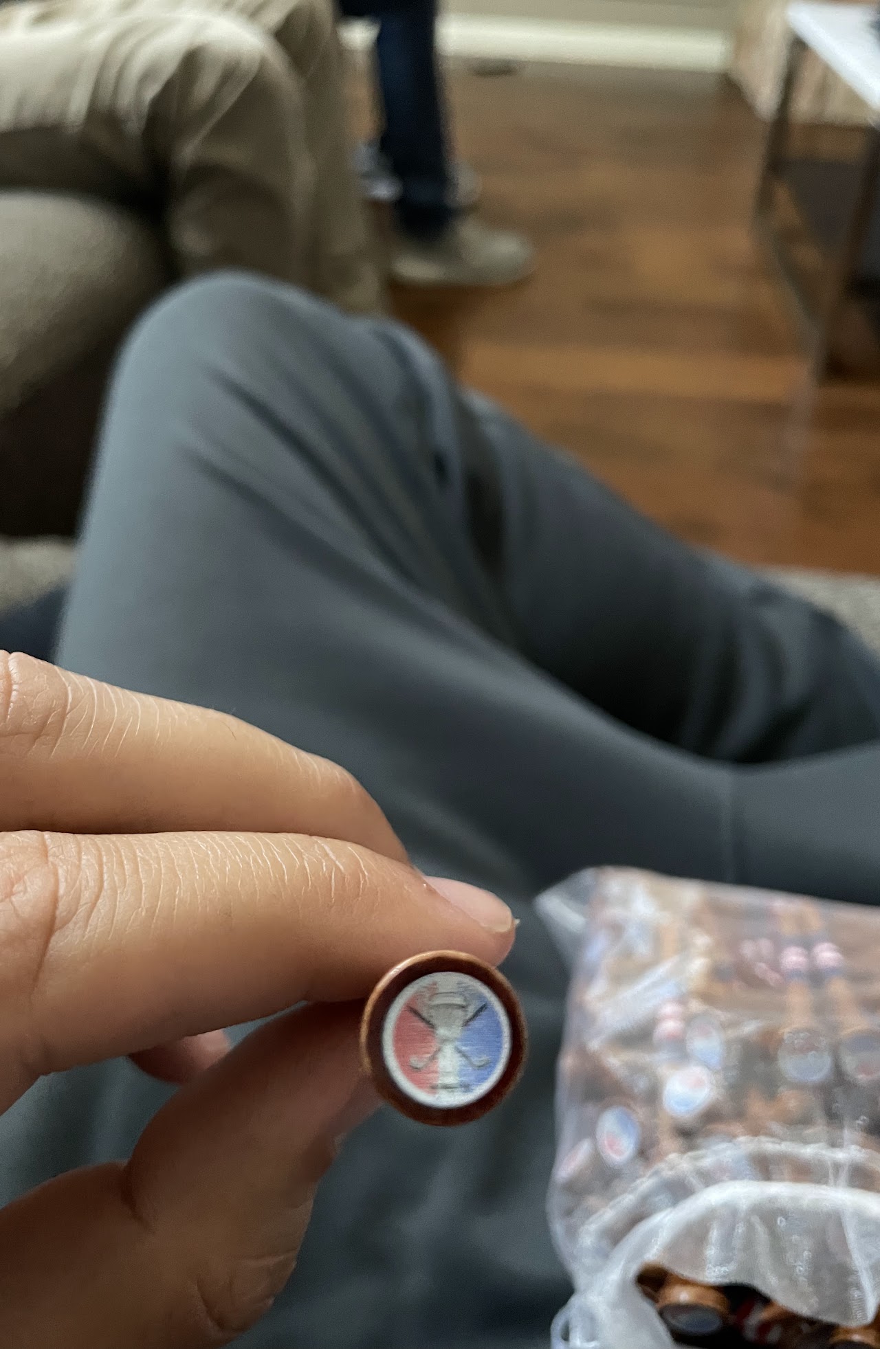 Danza Cup logo cap on the end of a golf tee